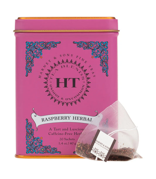 Harney & Sons raspberry herbal tea tin with floral design and pyramid tea sachet