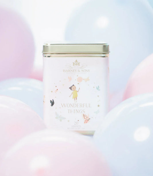 Harney & Sons Wonderful Things Girl tea tin with pastel balloons and illustrated girl on label