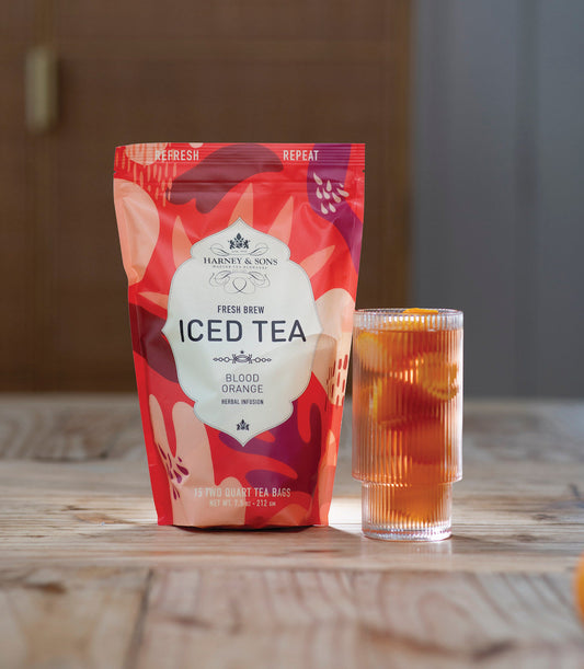 Harney & Sons iced tea package with a glass of iced tea on a wooden surface - blinks emporium