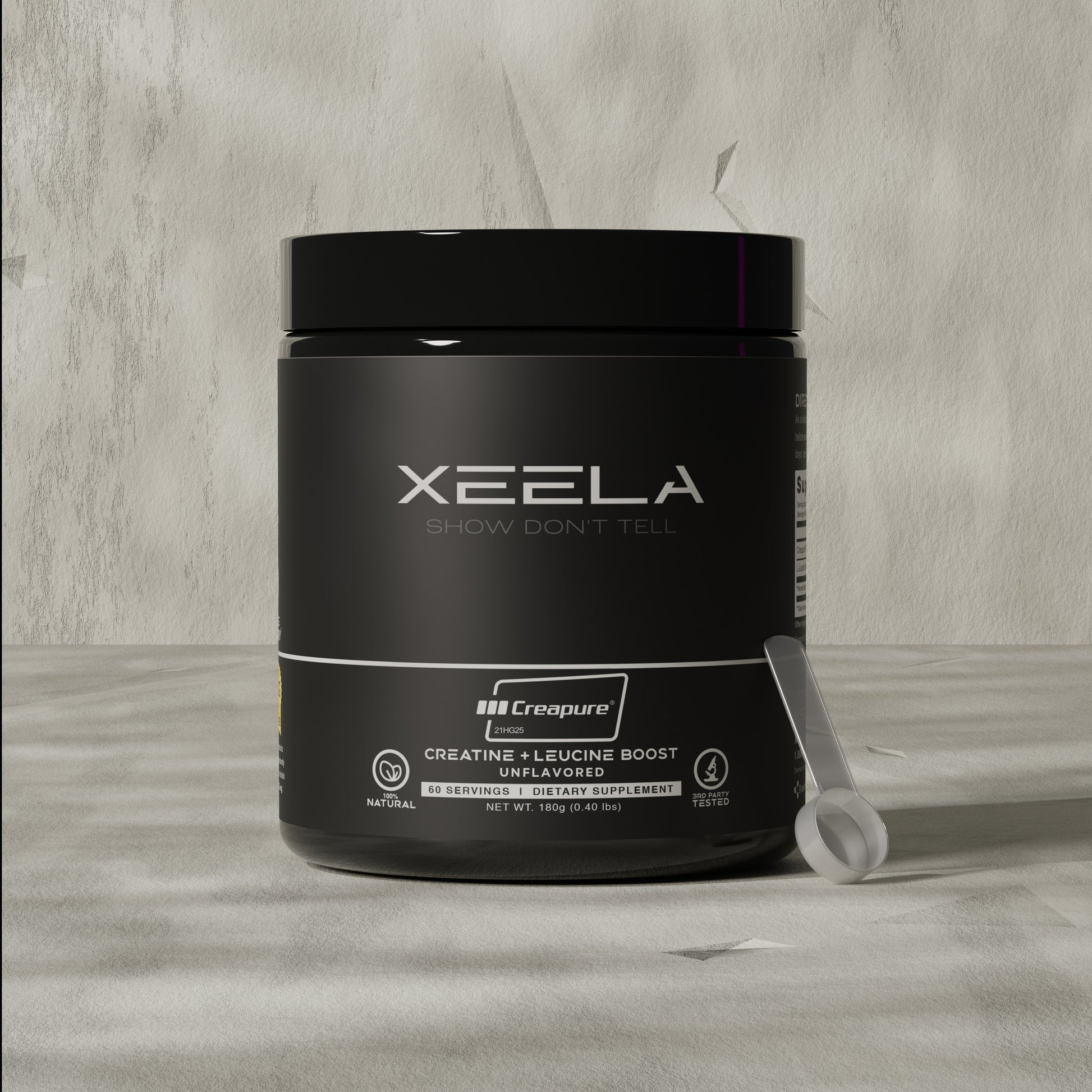 Black supplement container with 'XEELA' branding on a gray surface