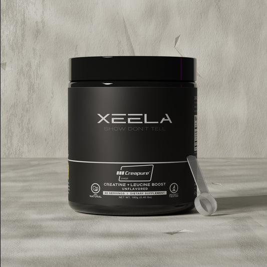 Black supplement container with 'XEELA' branding on a gray surface