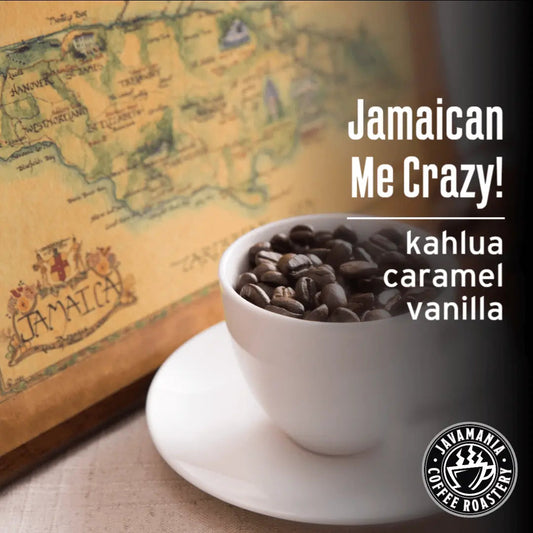 A white cup filled with whole Jamaican Me Crazy roasted coffee beans against a vintage map background, featuring text about Kahlua, caramel, and vanilla flavors. - blinks emporium